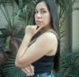 a woman in a black top is posing for a picture